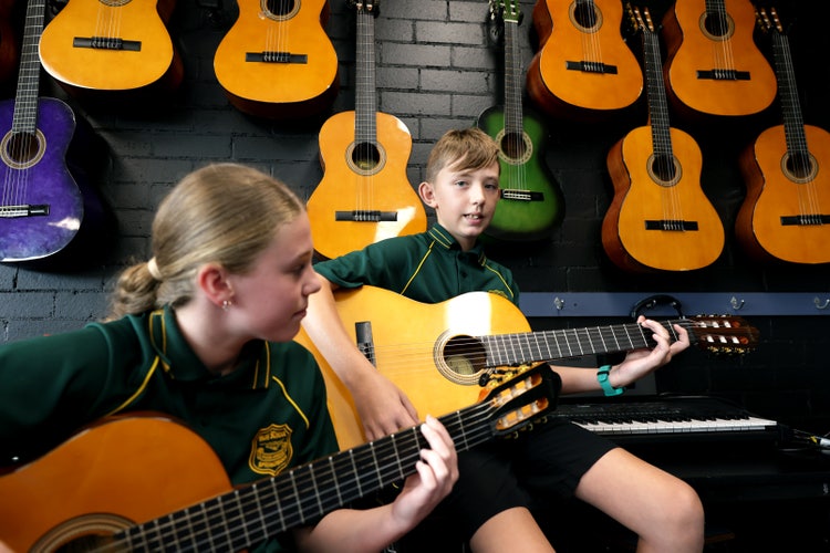 students playing guitar